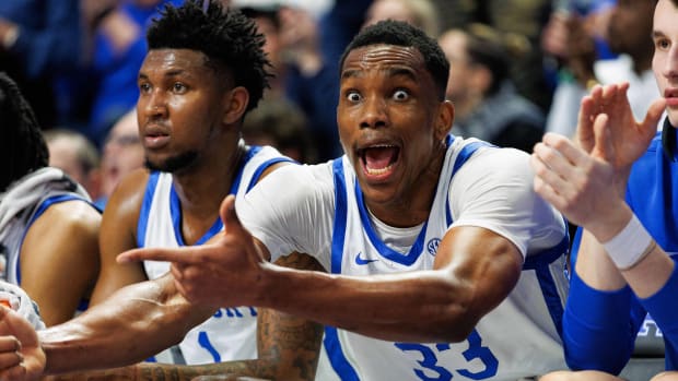 Feb 13, 2024; Lexington, Kentucky, USA; Kentucky Wildcats forward Ugonna Onyenso (33) celebrates from the bench during the second half against the Ole Miss Rebels at Rupp Arena at Central Bank Center. Mandatory Credit: Jordan Prather-USA TODAY Sports